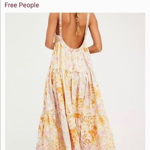 New with tag Free People light combo dress. Size large with pockets.
